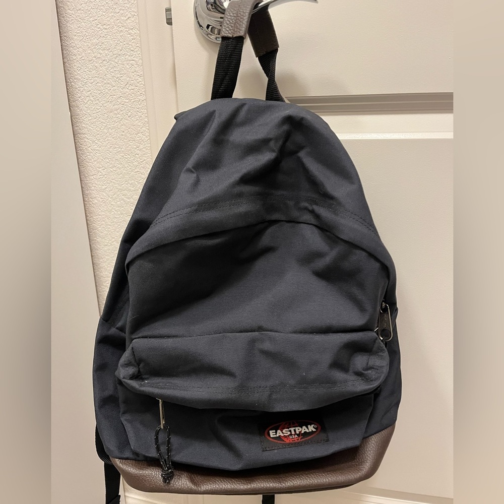 Eastpack backpack, Navy color, Brown Leather on the bottom part, Gently used